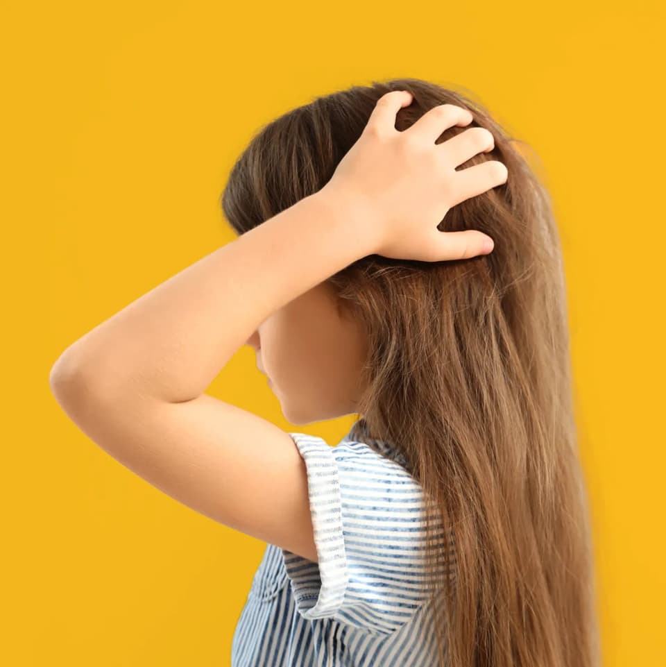 Young Girl with hands on hair