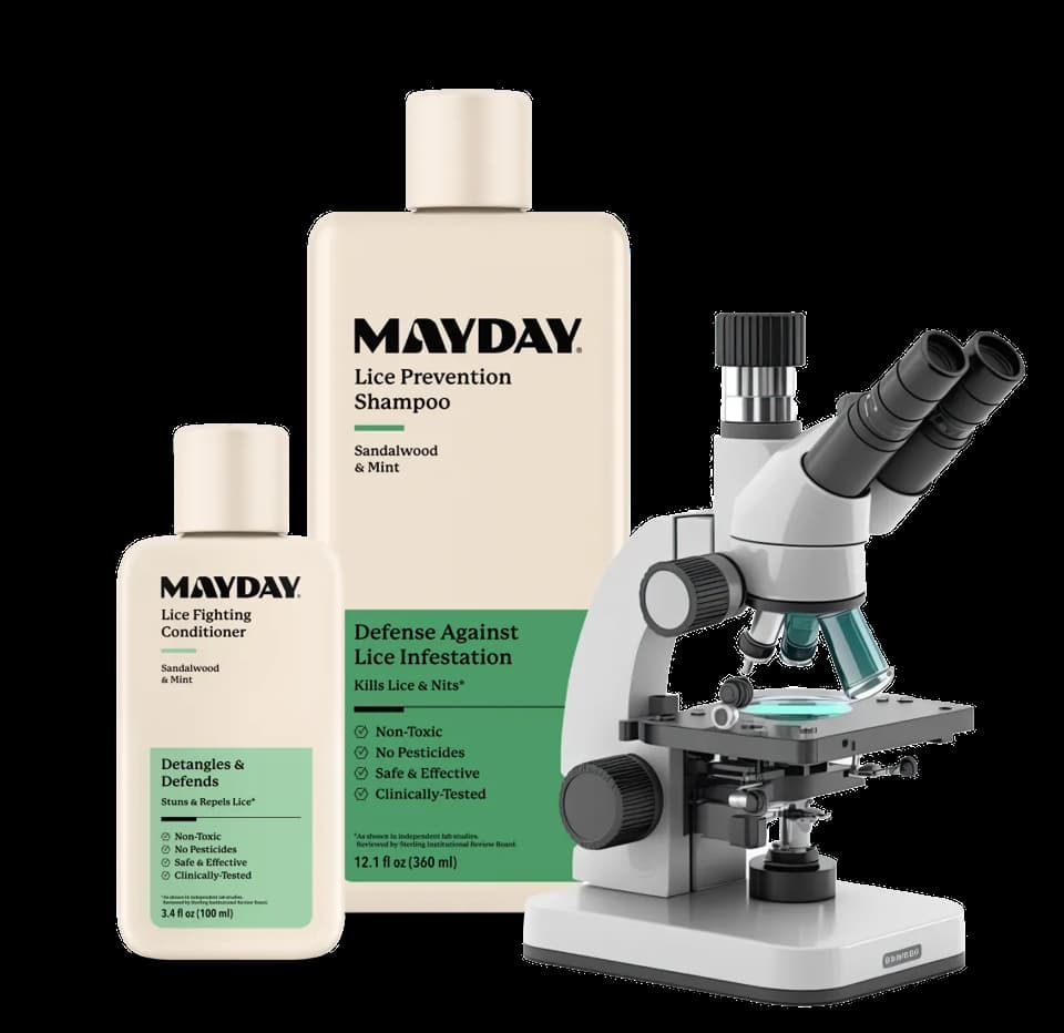 MAYDAY shampoo and conditioner bottles beside a microscope