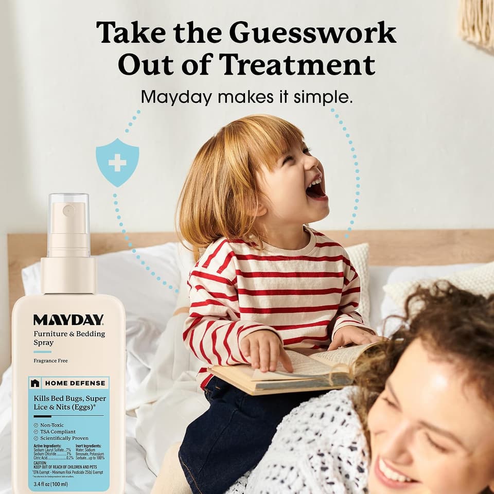 Laughing toddler on a bed with a parent, beside the Furniture & Bedding Spray
